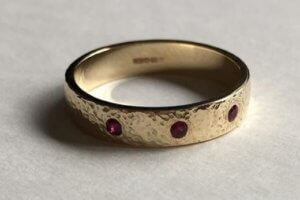 Hammered Wedding Ring with Rubies