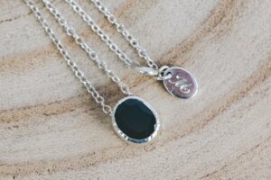 Oval Sapphire Pendant set in Hammered Silver with Engraved Tag