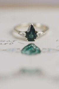 Pear Cut Teal Sapphire and Diamond Trilogy Engagement Ring