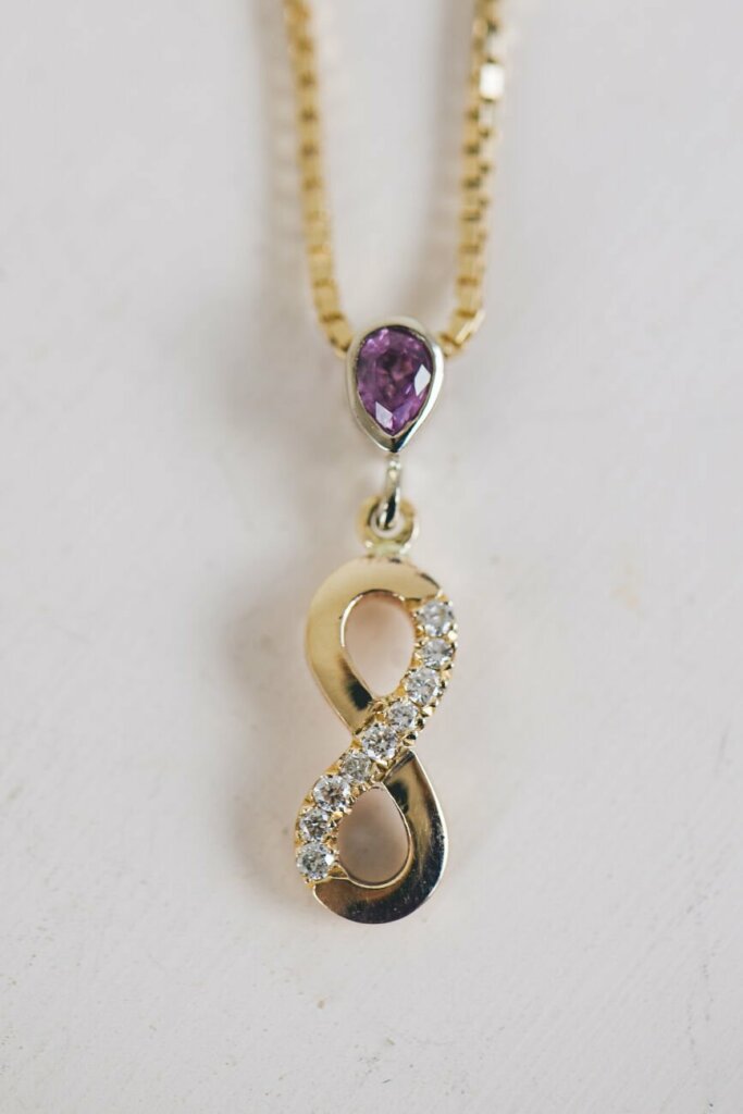 Infinity Pendant with Diamonds and Pink Sapphire