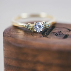 Brilliant Cut Moissanite and Green Sapphire Scatter Shoulder Engagement Ring
